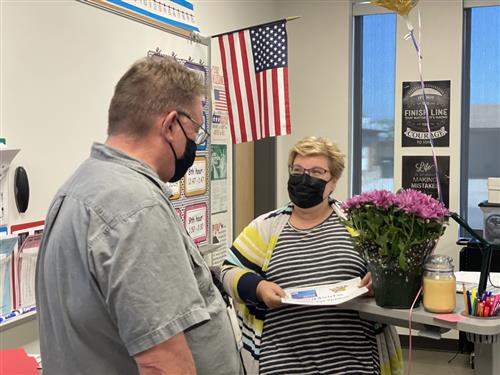 Mrs. Robertson talks with an APS employee