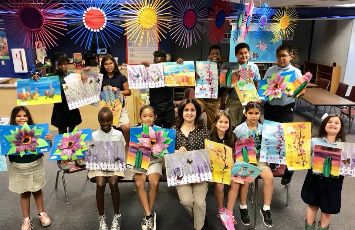  Students holding artwork