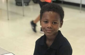  student in a dark blue polo