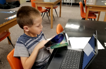  A student works on an assignment using a laptop