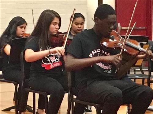 students practice the violin