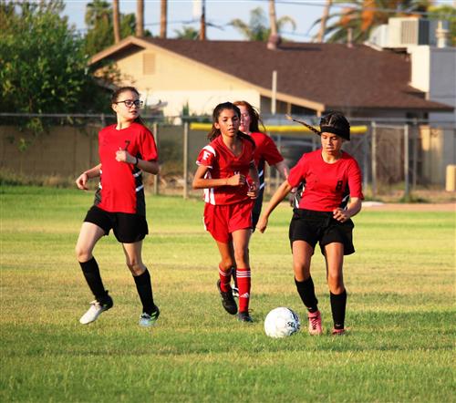 girls playin soccer
