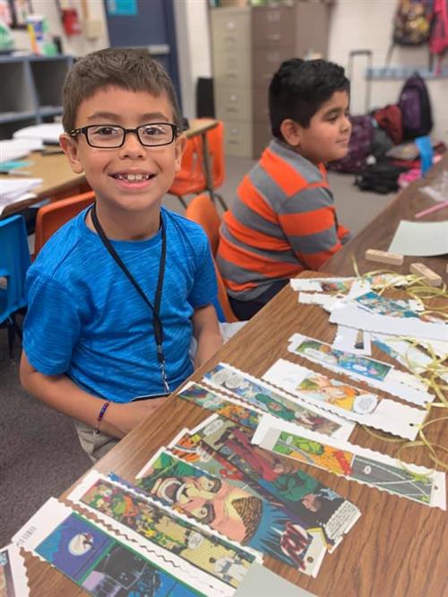 student working on art
