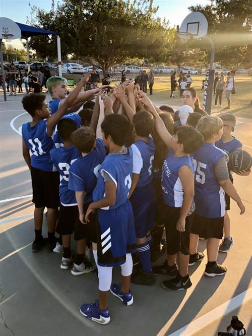 basketball team on a court in the afternoon