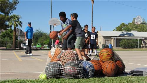 students play basketball