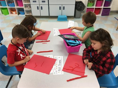 students work on an art project