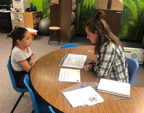 teacher working one on one with a student
