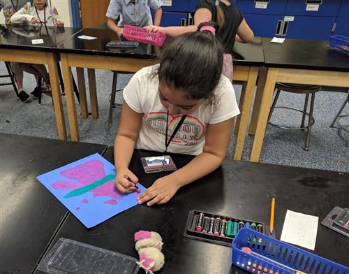 student working with pastels