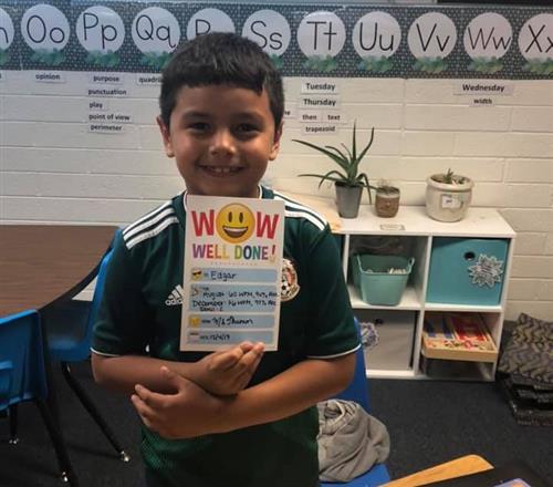 student holds a certificate