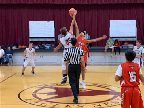 students play basketball in the gym