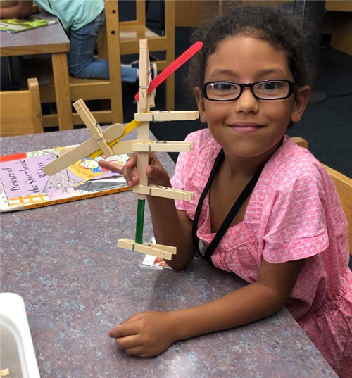 student builds a sculpture