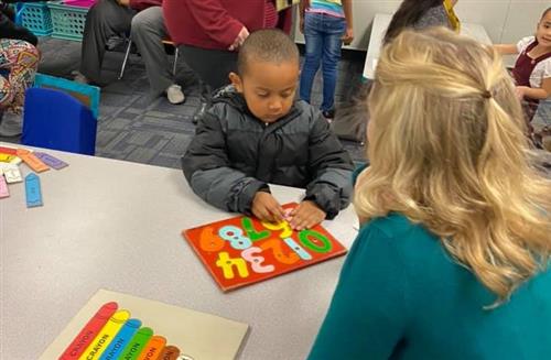 student receives one on one help from a teacher