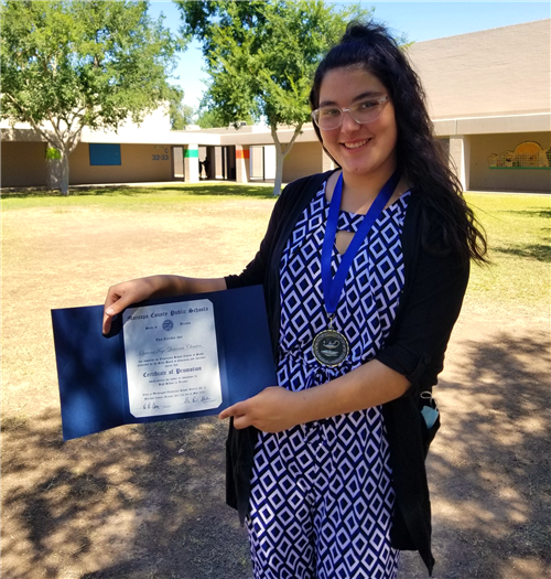 a student holds a diploma