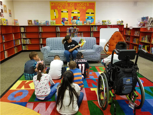 student read in the library