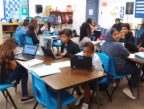 students work on chromebooks