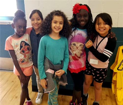 a group of students smiles